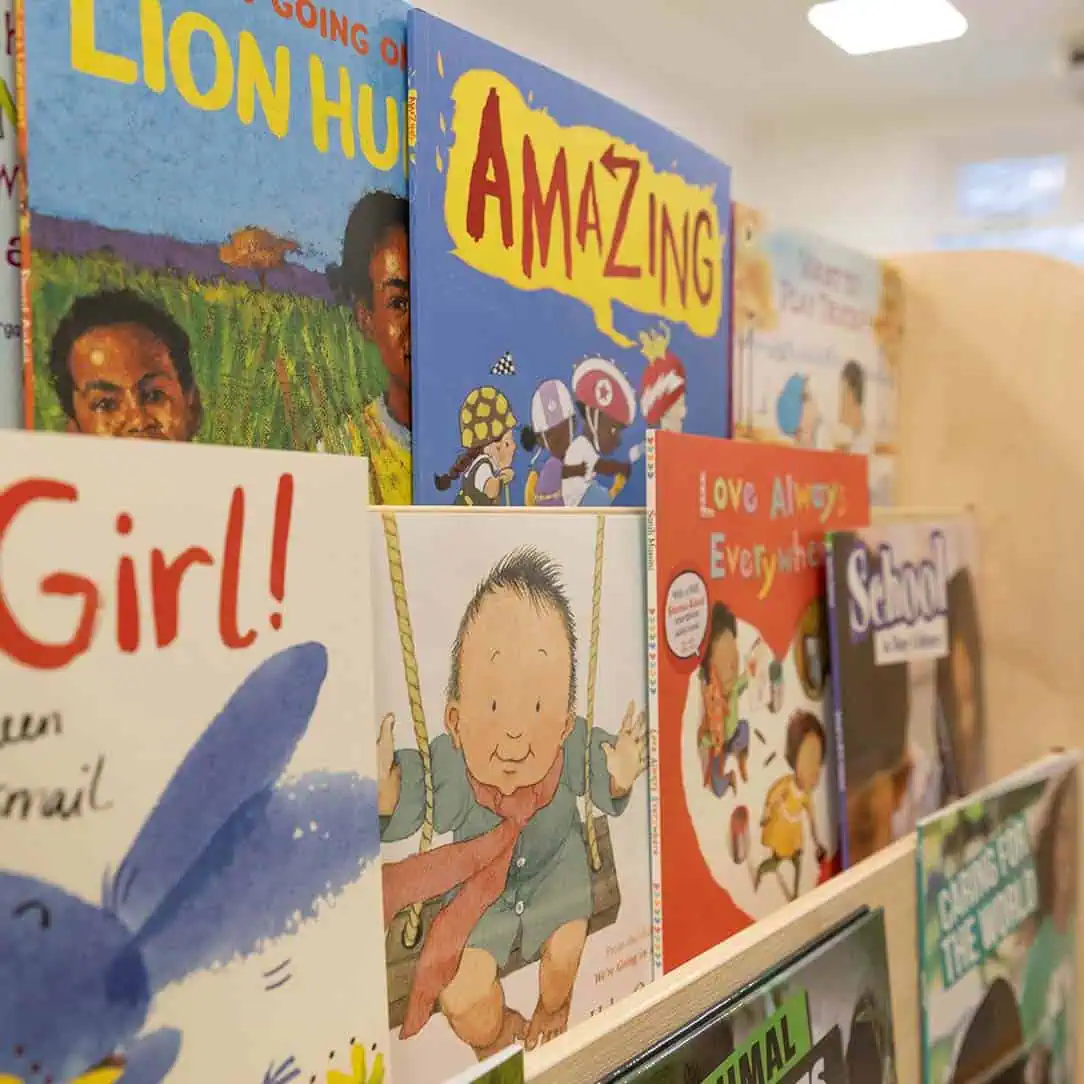 Colorful children’s books display at Monkey Puzzle Day Nursery Enfield, emphasizing early childhood literacy, learning, and developmental activities for young kids.