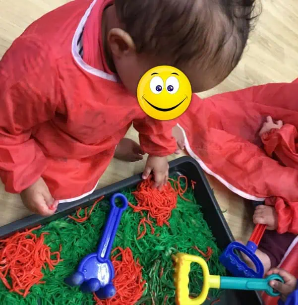 Cloth sensory play activity at Monkey Puzzle Day Nursery Enfield, engaging early childhood development through tactile exploration and educational fun.