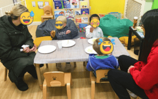 Healthy children enjoying snack time at Monkey Puzzle Day Nursery Enfield, showcasing a bright, engaging environment that supports early childhood development and learning.