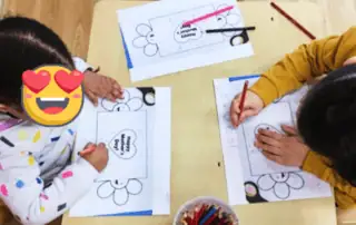 Monkey Puzzle Day Nursery Enfield children engaging in creative coloring activity.