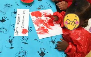 Happy Women's International Day art activity at Monkey Puzzle Day Nursery Enfield, showcasing children engaging in creative celebration and expression, highlighting a nurturing environment for early childhood development.