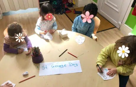 St. george's day themed preschool activity at Monkey Puzzle Day Nursery Enfield with young children crafting and celebrating.