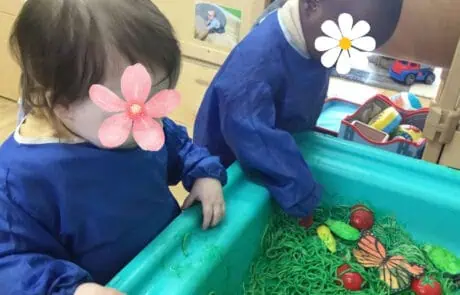 Flowers, children, colorful sensory play at Monkey Puzzle Day Nursery Enfield.