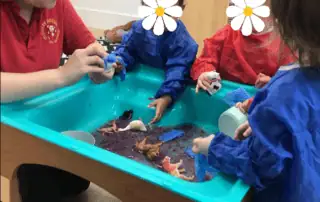 Playschool children engaging in sensory play with stuffed animals at Monkey Puzzle Day Nursery Enfield, fostering early development, interaction, and education.