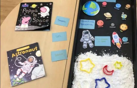 Peppa Pig in Space and Astronaut children's books with space-themed sensory activity at Monkey Puzzle Day Nursery Enfield. Kids engage in imaginative learning about planets and astronauts.