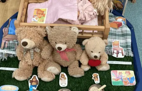 Soft plush teddy bears with educational sensory play setup at Monkey Puzzle Day Nursery Enfield, ideal for early childhood development and interactive learning activities.