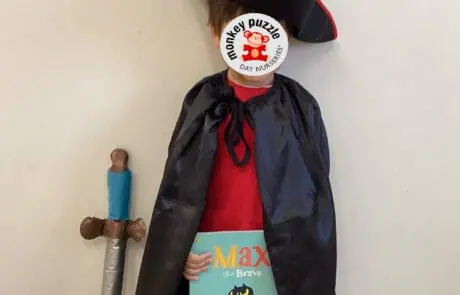 Toy sword with blue handle and brown pom-pom accents, perfect for imaginative play at Monkey Puzzle Day Nursery Enfield.
