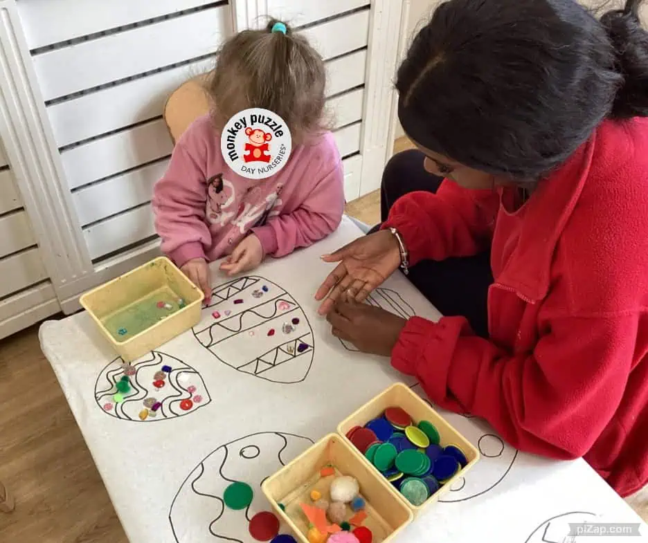 Egg-shaped Easter craft activity with children at Monkey Puzzle Day Nursery Enfield, engaging in creative and educational arts and crafts for early childhood development.