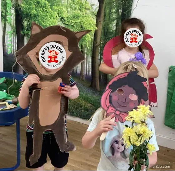 Monkey Puzzle Day Nursery Enfield children playing with animal masks and flowers in a creative indoor environment.