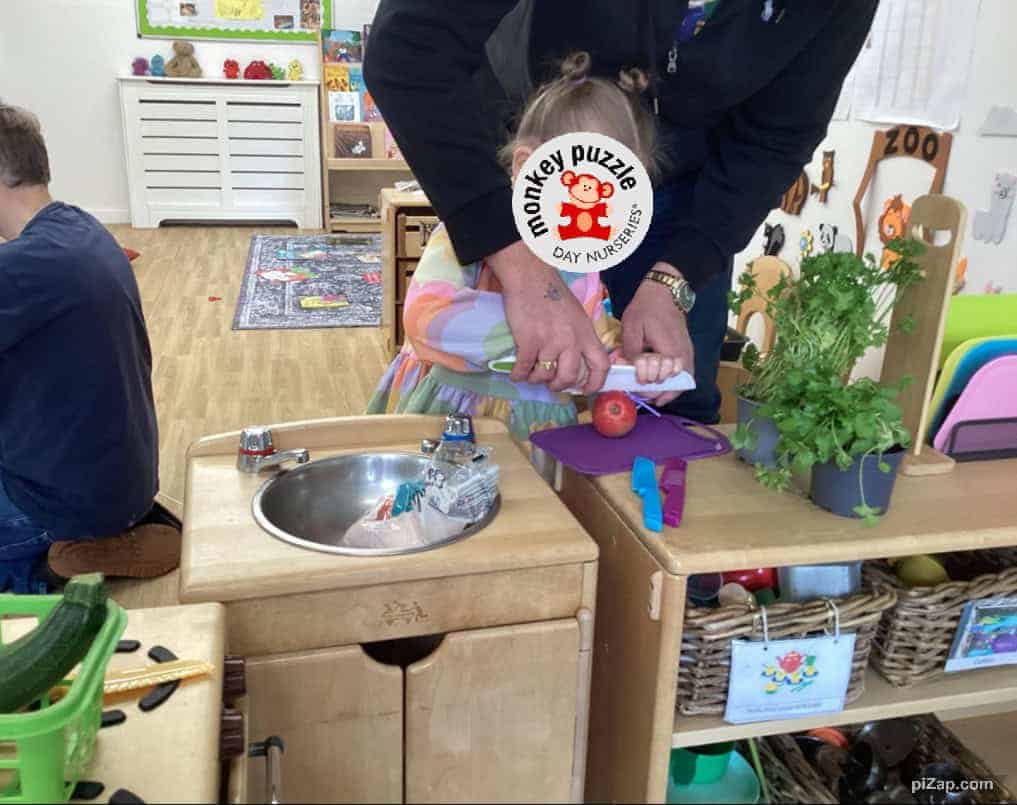 Fresh apples and herbs in a day nursery for children’s cooking activities at Monkey Puzzle Enfield.