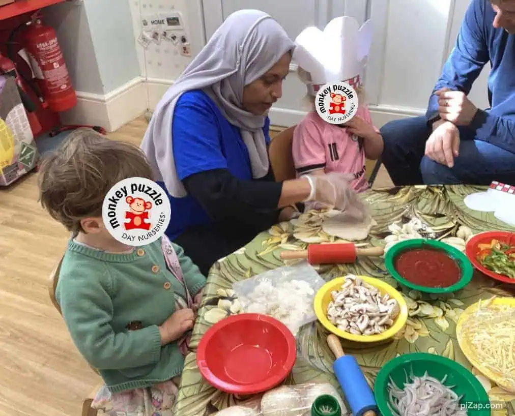 Freshly prepared pizza ingredients on a table at Monkey Puzzle Day Nursery Enfield, emphasizing healthy food activities for children and fostering motor skills and teamwork.