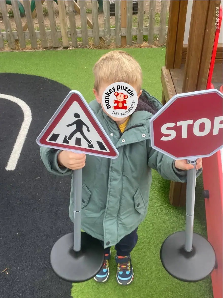 Pedestrian crossing and stop signs for children at Monkey Puzzle Day Nursery Enfield.